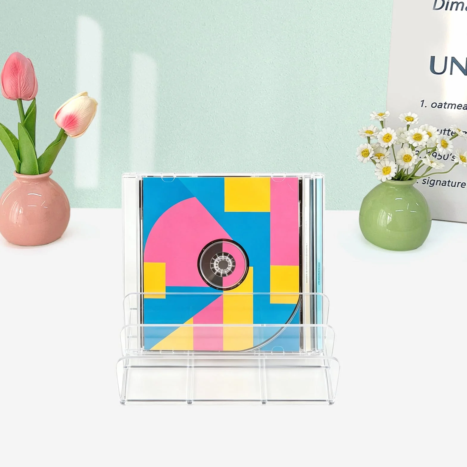 Organizador transparente para CD/DVD de acrílico – Conjunto de 4 piezas – Almacenamiento para CDs, DVDs, cintas, cintas de juegos y libros – Diseño elegante con soporte estable para una presentación